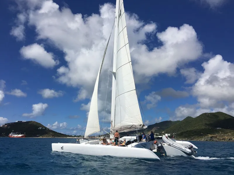 Trimaran anchored in a quiet bay for snorkeling on a Sint Maarten island tour sailing cruise in Sint Maarten