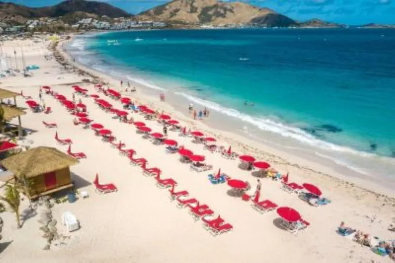 Low-flying plane over sunbathers at Maho Beach on an Orient and Maho beaches Sint Maarten island tour in Sint Maarten